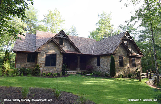 The Hardesty house plan 1287 with a rustic facade and natural landscaping.