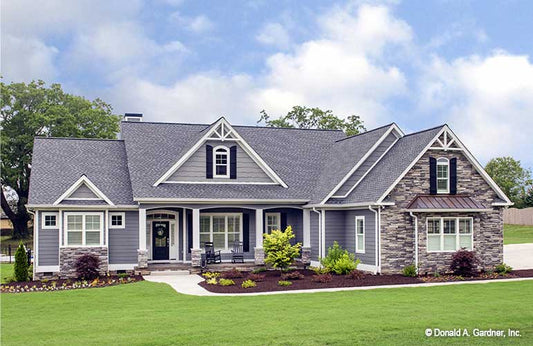 Front exterior of one-story Craftsman house plan The Lucy Plan 1415.