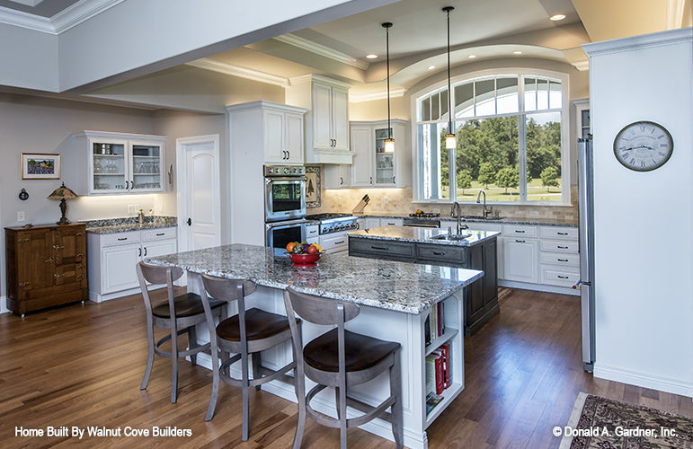 Island kitchen of The Chesnee house plan 1290. 