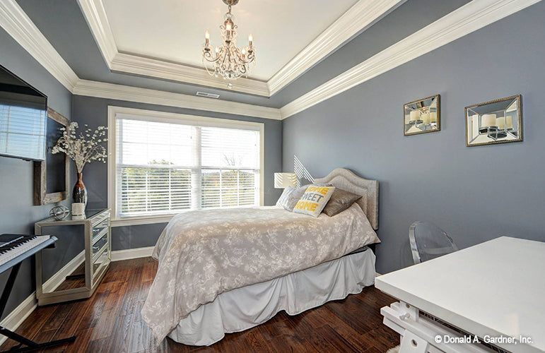 Chandelier and tray ceiling in the bedroom. The Barclay plan 248.