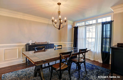 Chandelier and crown molding along the ceiling in the dining room. The Barclay plan 248.