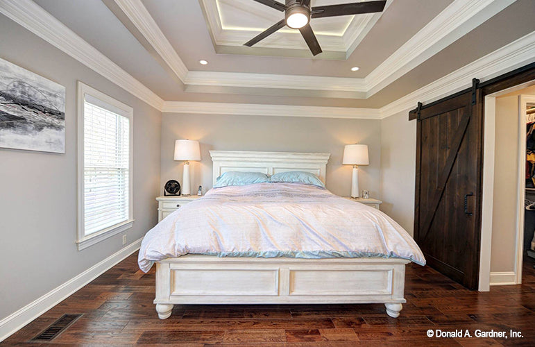 Tray ceiling and recessed lights in the master bedroom. The Barclay plan 248.