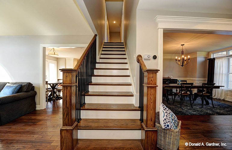 Stained wood flooring on the staircase. The Barclay plan 248.