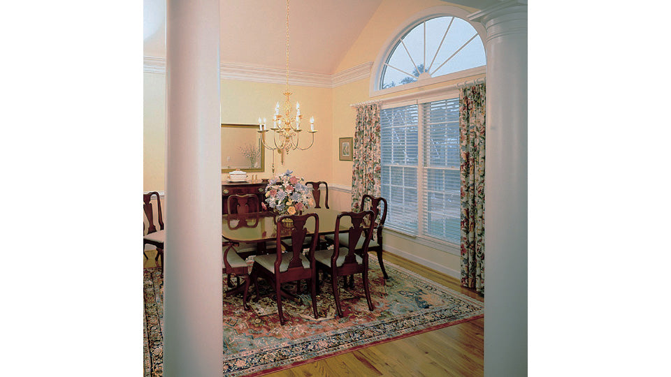 This is a photo of the dining room for traditional house plan 297 The Irwin as built by a customer