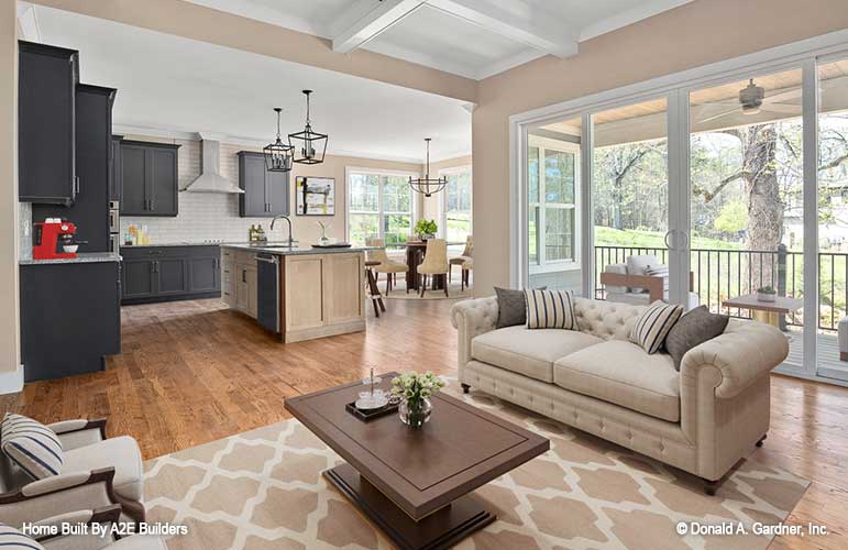 Great room view with the double sliding glass doors and kitchen off to the side. Agatha plan 1500