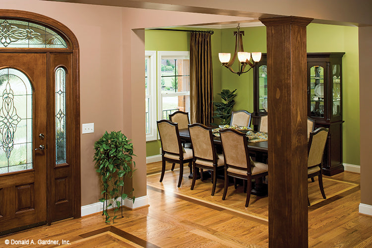 Foyer view into the dining room with wood flooring. The Amherst plan 753.