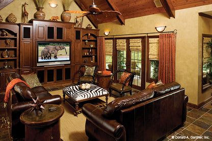 Wood panel cathedral ceiling in the family room. The Amherst plan 753.