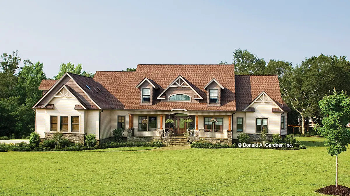 Photographs submitted by the customer. Front view photograph of a craftsman style home. The Amherst plan 753.