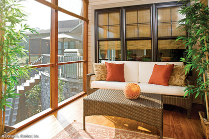 Seating area in the screened in porch. The Amherst plan 753.