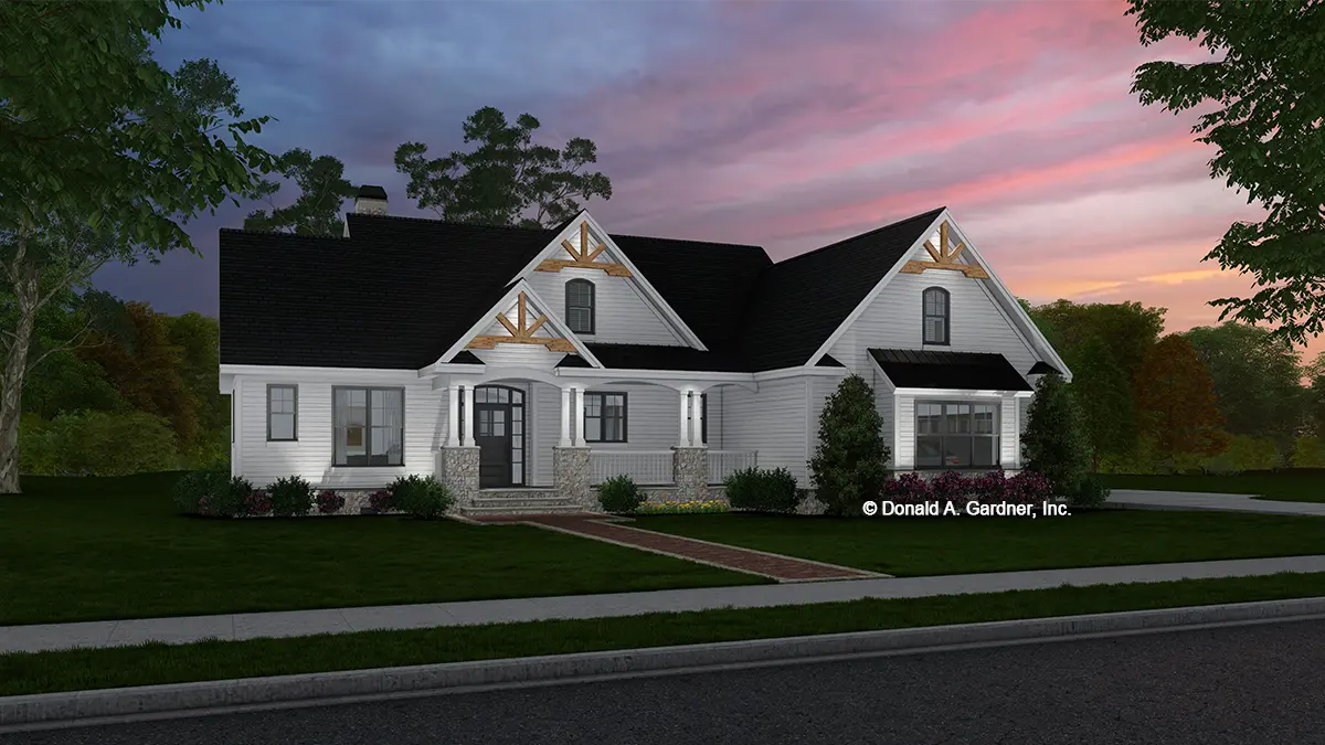 This is an illustration of the front of ranch house plan 1426 The Anna at dusk