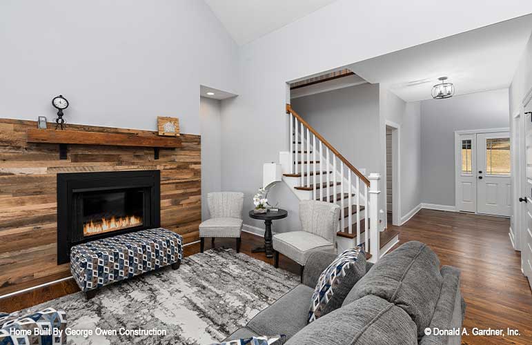 Cozy by the fireplace in this Great room with stairs off to the side. Applecross plan 1501