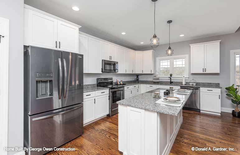 Classy kitchen with kitchen island bar, perfect for entertaining. Applecross plan 1501