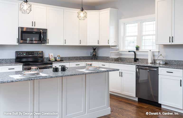 Large kitchen sink with double windows above. Applecross plan 1501