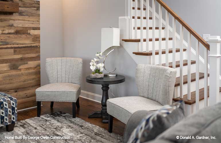 Peaceful conversation area beside the stairway. Perfect view off this covered deck with outdoor ceiling fan. Applecross plan 1501