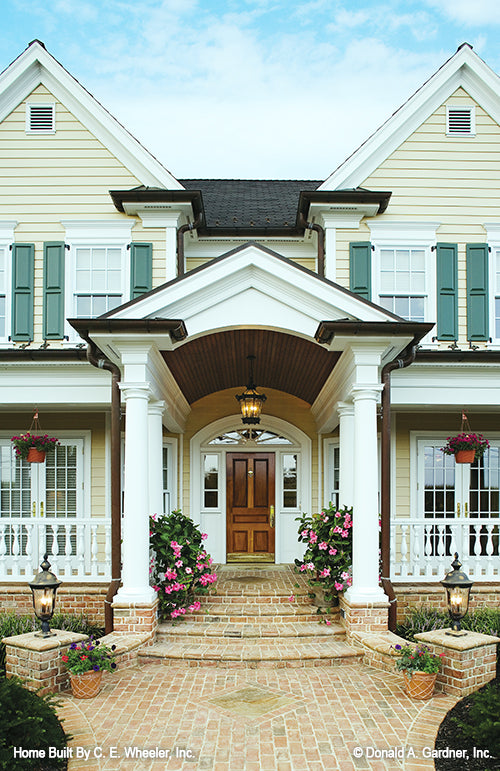 Front porch view brick walkway and steps. The Arbordale plan 452.