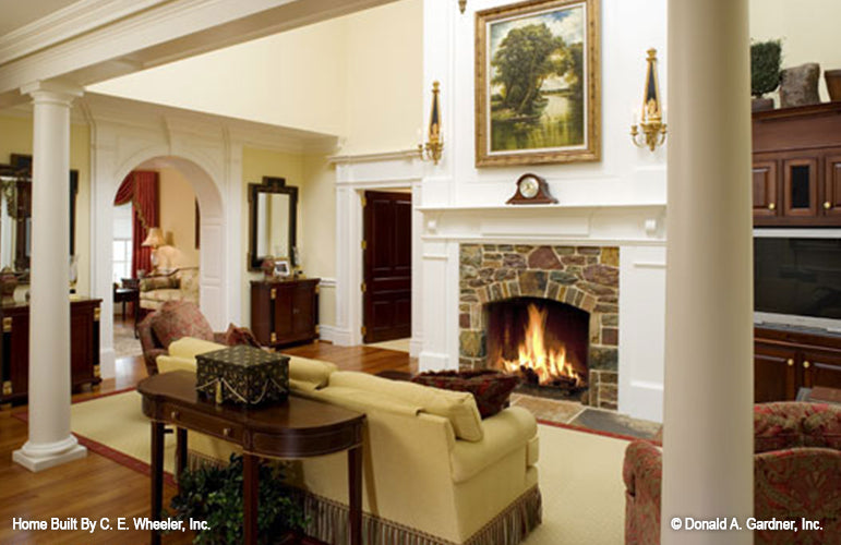 Columns and stone fireplace in the great room. The Arbordale plan 452.