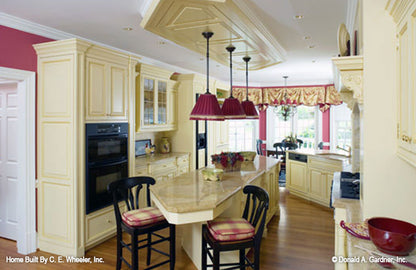 Recessed light and island in the kitchen. The Arbordale plan 452.