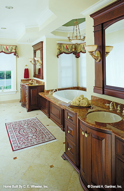 Two vanities separated by sitting tub in the master bathroom. The Arbordale plan 452.