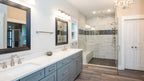 The master bath provides a private oasis for one story house plan 1506 The Ashbry