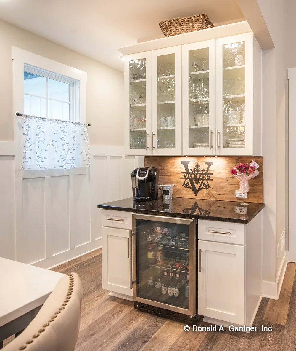 A convenient wet bar is tucked into a corner of simple house plan 1506 The Ashbry