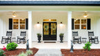 The front porch welcomes visitors to one story house plan 1506 The Ashbry