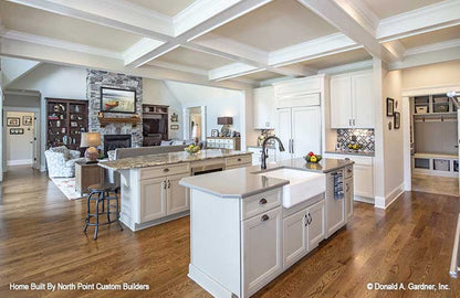 The kitchen lies at the heart of craftsman house plan 1409 The Austin