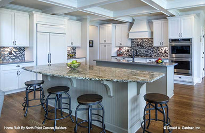 Dual islands provides extra counter and prep space  for ranch house plan 1409 The Austin