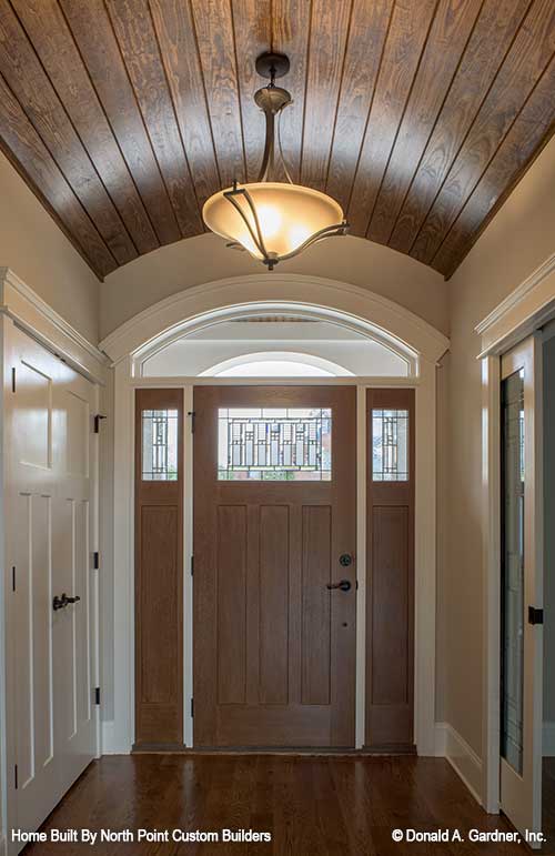 The foyer makes the first impression for visitors to craftsman house plan 1409 The Austin