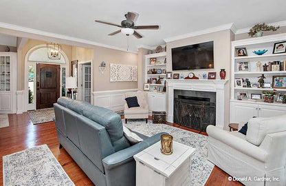 Fireplace and mantal with a tv above in the great room. The Avant plan 1346.