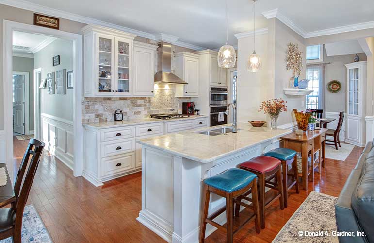 Bar seating at the island in the kitchen. The Avant plan 1346.