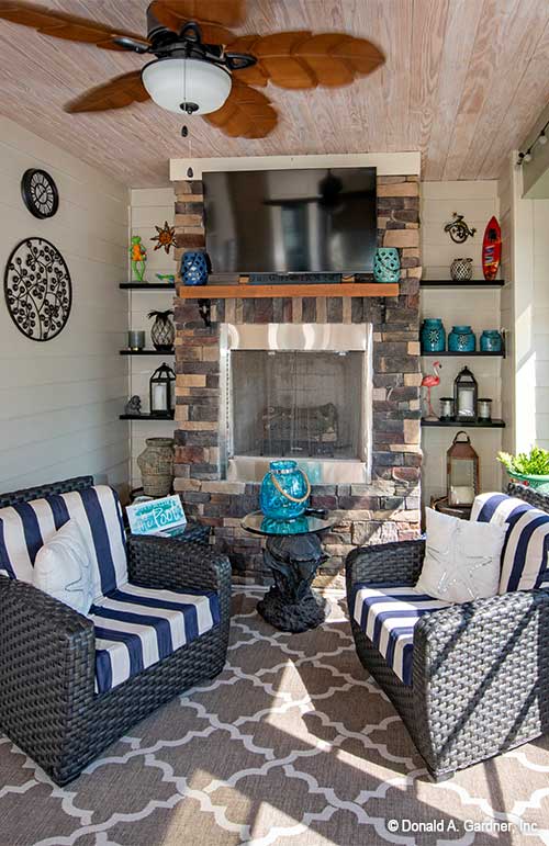 Outdoor fireplace in the screened in porch. The Avant plan 1346.