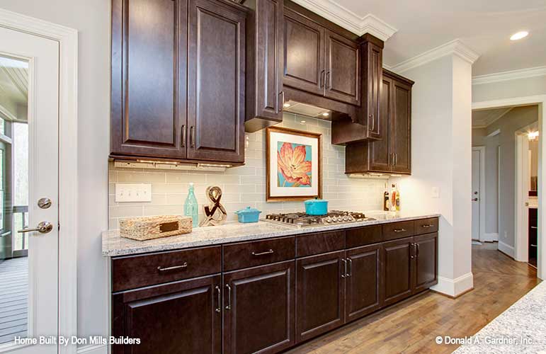 Dark brown cabinets in the kitchen. The Bantry plan 1336.