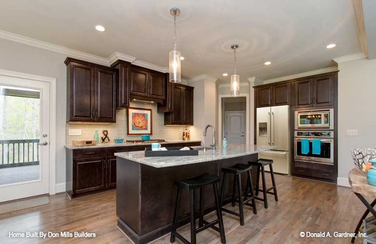 Hanging pendant lights over the island in the kitchen. The Bantry plan 1336.