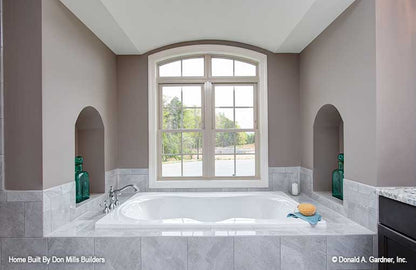 Soaking tub with window in the master bathroom. The Bantry plan 1336.