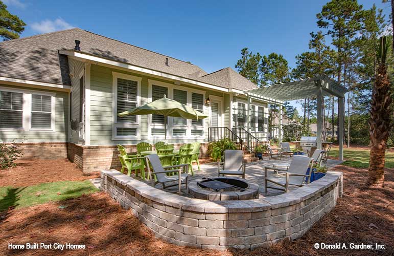 Rear view of the patio and pergola. The Barlett plan 1372. 