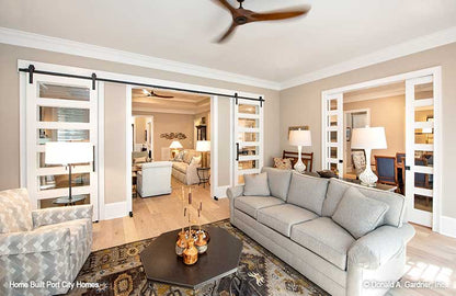 Sitting room view shows pocket doors leading to the dining room. The Barlett plan 1372. 