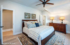 Cozy secondary bedroom with ceiling fan. The Barlett plan 1372. 