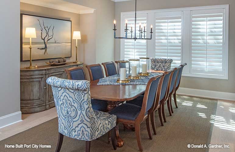 Triple windows and chandelier in the dining room. The Barlett plan 1372. 