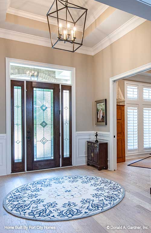 Spacious foyer with chandelier. The Barlett plan 1372. 