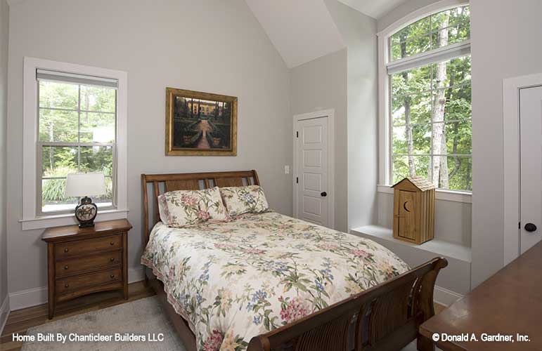 Arched window and bench seating in the secondary bedroom. The Baskerville plan 1312.