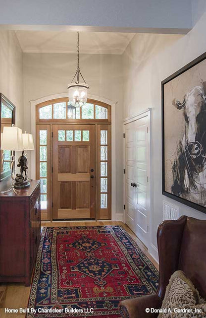 Arched window above the entry door in the foyer. The Baskerville plan 1312.