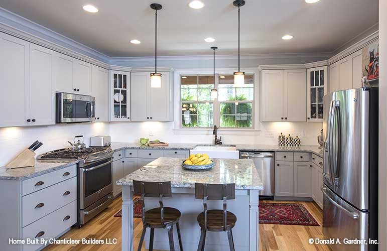 White cabinets in the kitchen. The Baskerville plan 1312.