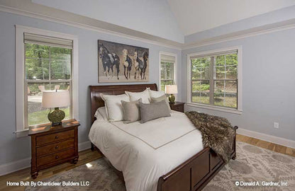 Crown molding along the ceiling and windows int he master bedroom. The Baskerville plan 1312.