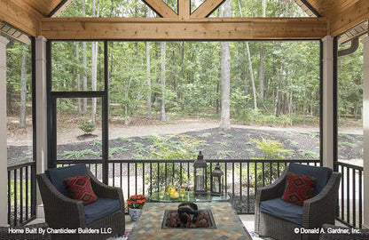 Screen door to the yard in the screened in porch. The Baskerville plan 1312.