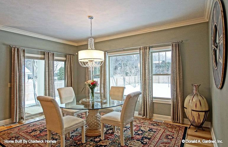 Crown molding along the ceiling in the dining room. The Beauxville plan 1236.