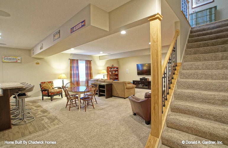 Stairs leading up from the entertainment room. The Beauxville plan 1236.