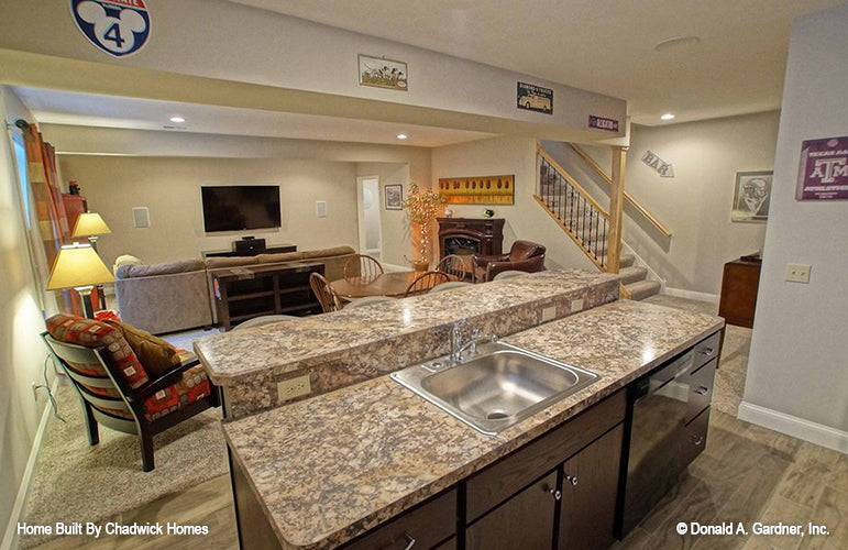 Counter with sink and bar in the entertainment room. The Beauxville plan 1236.