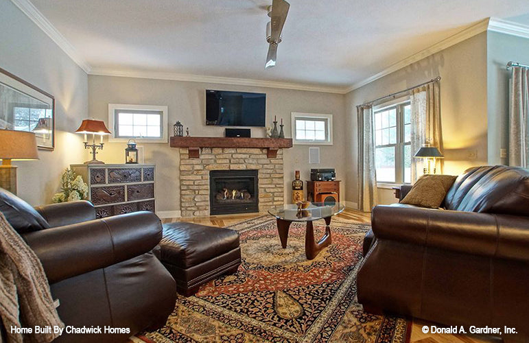 Flat ceiling with crown molding in the great room. The Beauxville plan 1236.