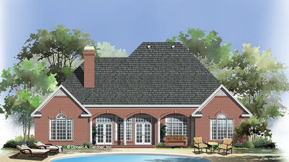 red brick home with 3 arches that define the covered porch and hold the french doors behind