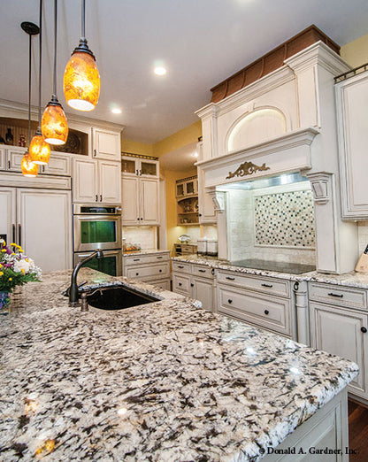 Island view of the flat countertop stove. The Birchwood plan 1239.